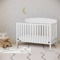 BOUSSAC Benton 5 in 1 Convertible Baby Crib in white in a baby nursery room | Ninja Toddler