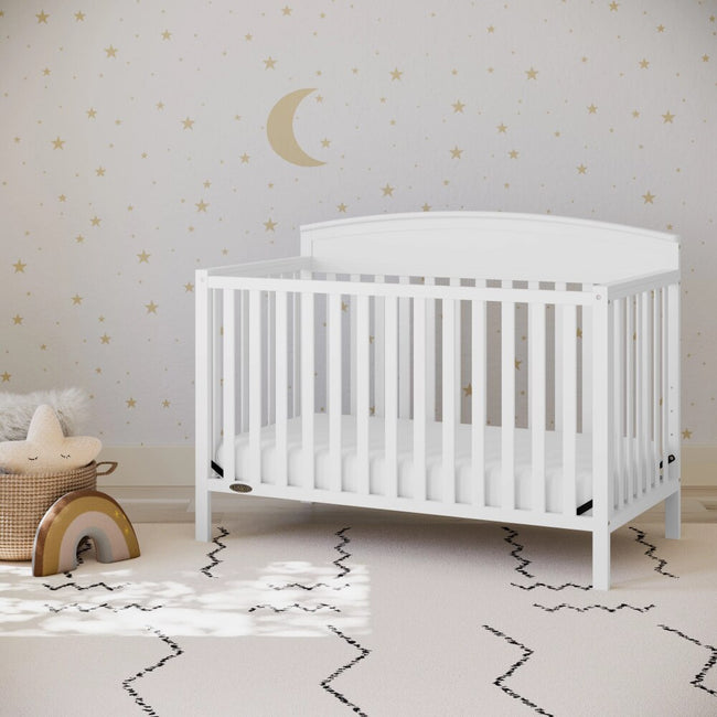 BOUSSAC Benton 5 in 1 Convertible Baby Crib in white in a baby nursery room | Ninja Toddler